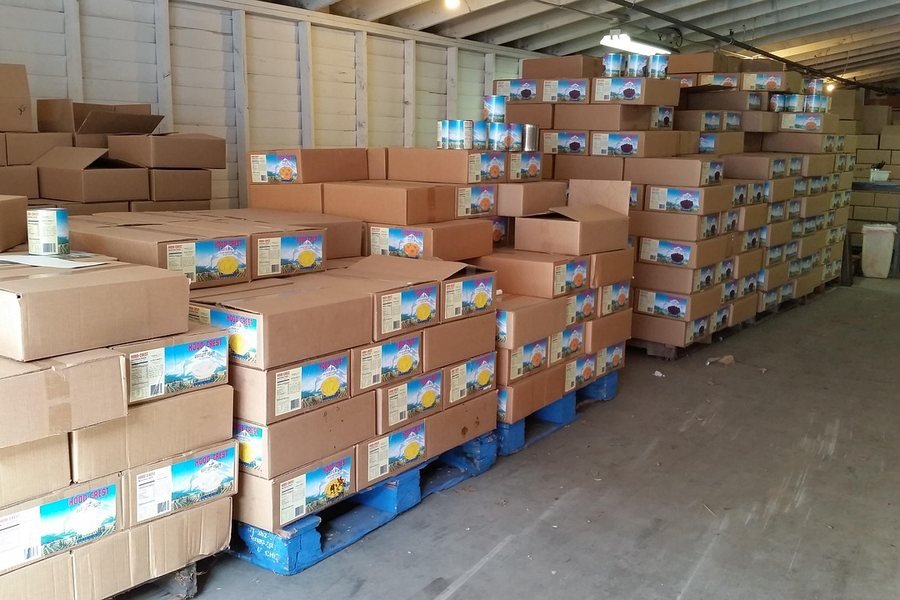 Boxes on shelves in a small warehouse